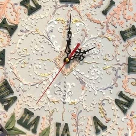 Raised ornament on a clock face