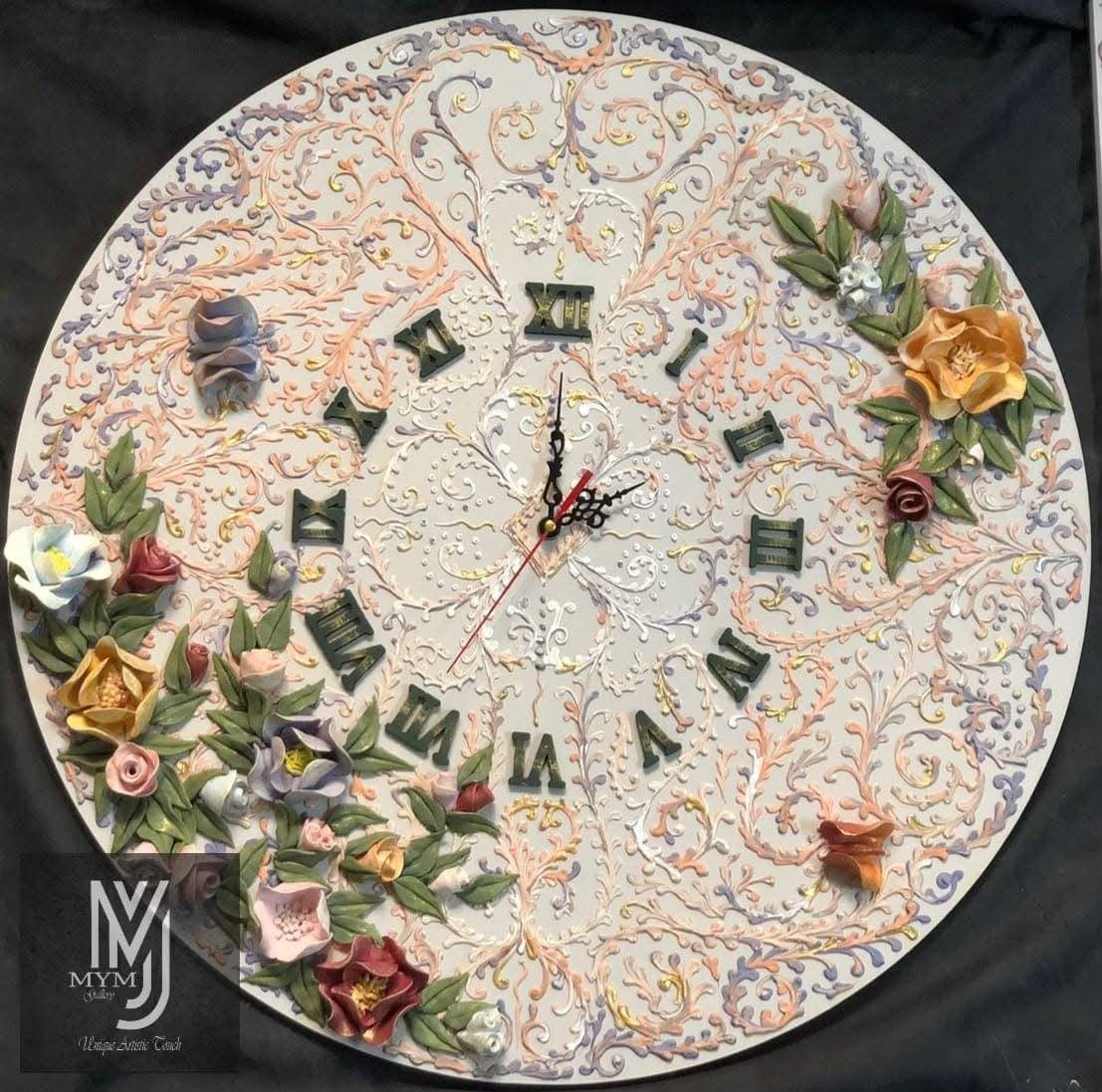 Round wall clock with raised pastel scrollwork, Roman numerals and sculpted flowers along its edge